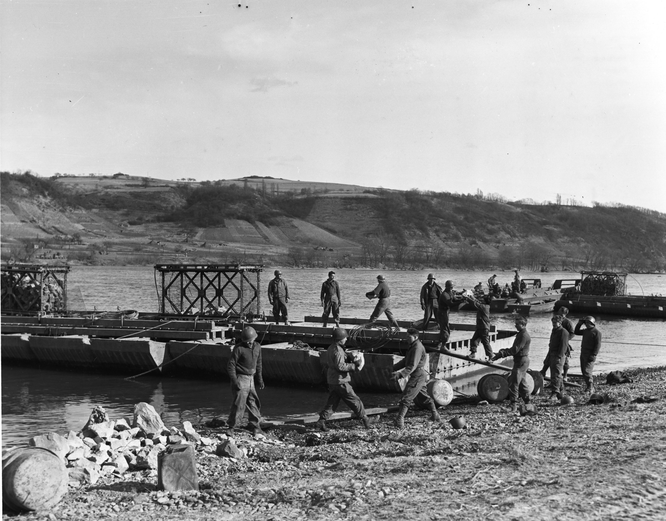 Soldiers building a floating bridge